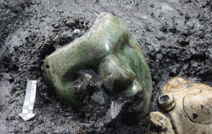 Beautiful artistic creations made by humankind and civilization over time, A green serpentine mask uncovered at the base of a pyramid in Mexico that is 2000 years old