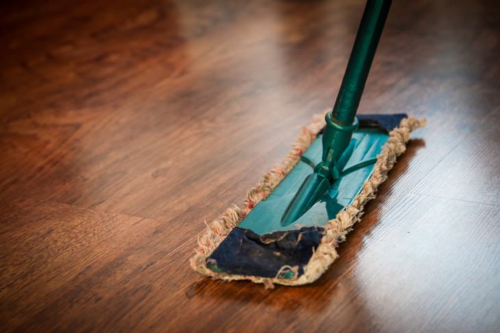 Things You Shouldn't Clean With Vinegar mopping wood floor