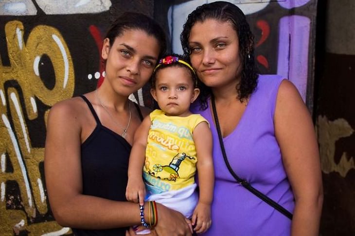 The Beauty of Motherhood in 18 Different Cultures Mother and her two daughters, Rio De Janeiro, Brazil