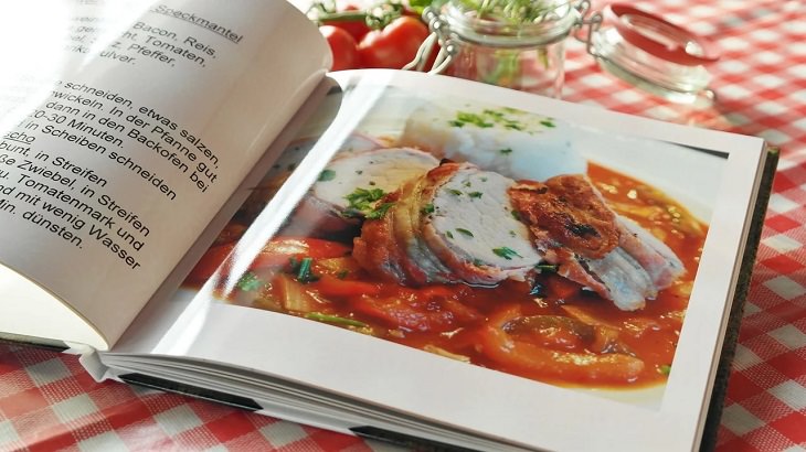 Helpful cooking, baking, and kitchen tips, Recipe book open to a page with a picture of a dish