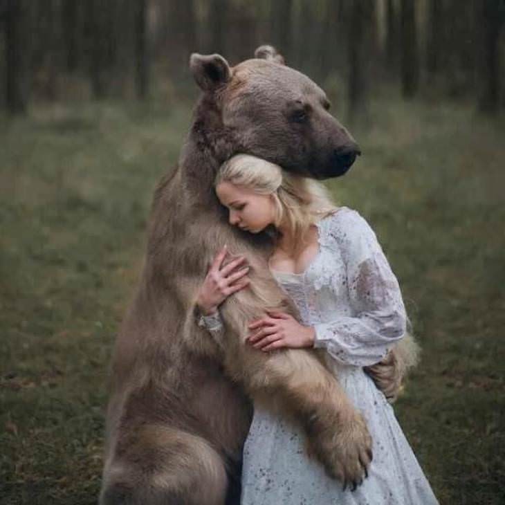 Poignant Photos with Fascinating Backstories, bear hugging woman