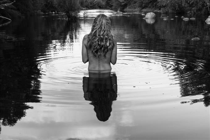 black and white nude woman in lake