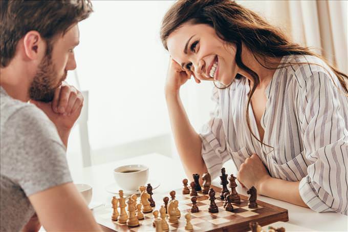 young couple playing chess