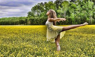 woman dancing in a field
