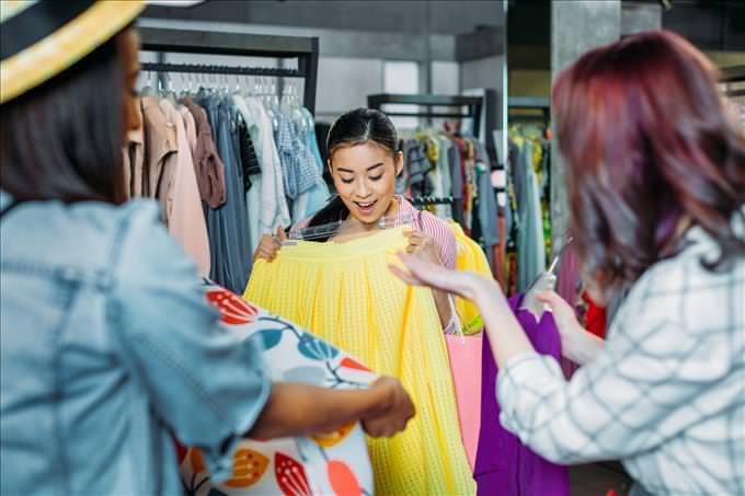 young women buying clothes