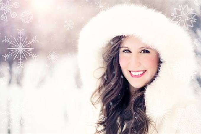 find the difference: woman smiling on a snowy day