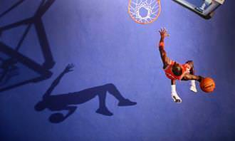 basketball player dunking ball
