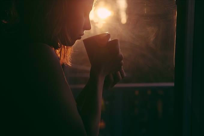 girl drinking coffee in the evening