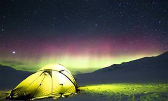 tent under northern lights