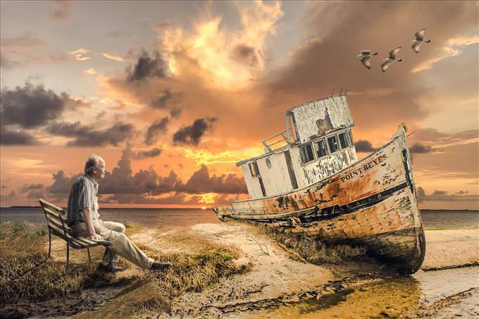 old man looking at shipwreck