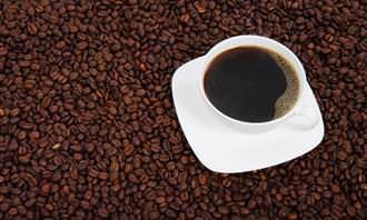 black coffee cup with coffee beans