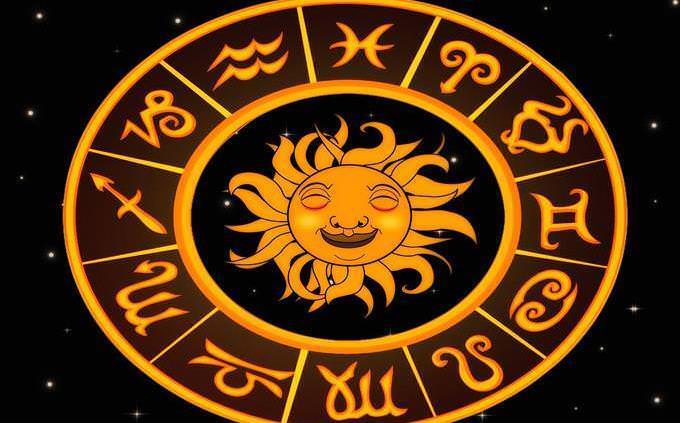 a symbol of the sun surrounded by the astrological wheel
