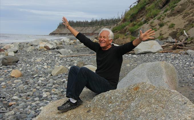 happy senior man on beach
