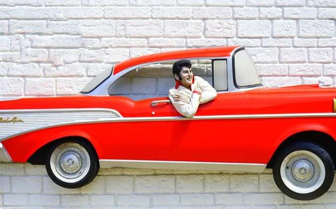 Elvis in red cadillac
