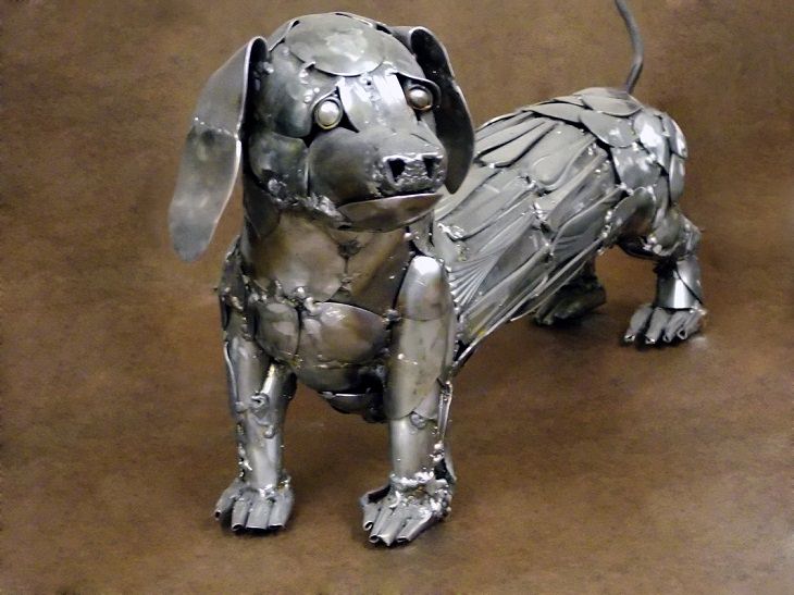 Sculptures welded and made using kitchenware, silverware and other utensils by Ohio Artist diagnosed with Parkinson’s Disease, Gary Hovey, It's A Stretch; dachshund